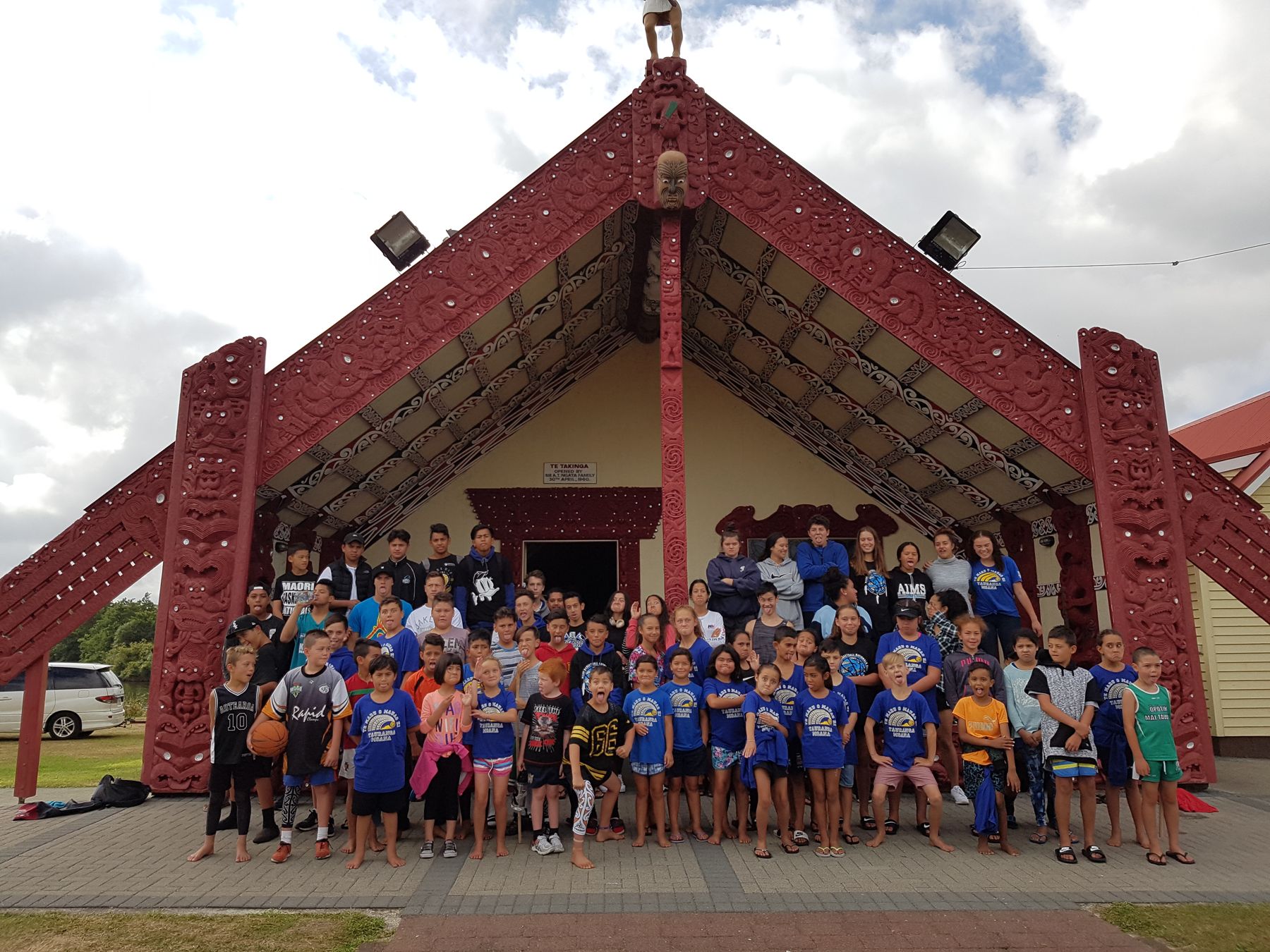 The 2017 Te Maru o Mauao squad gathered in front of the wharenui at Te Takinga